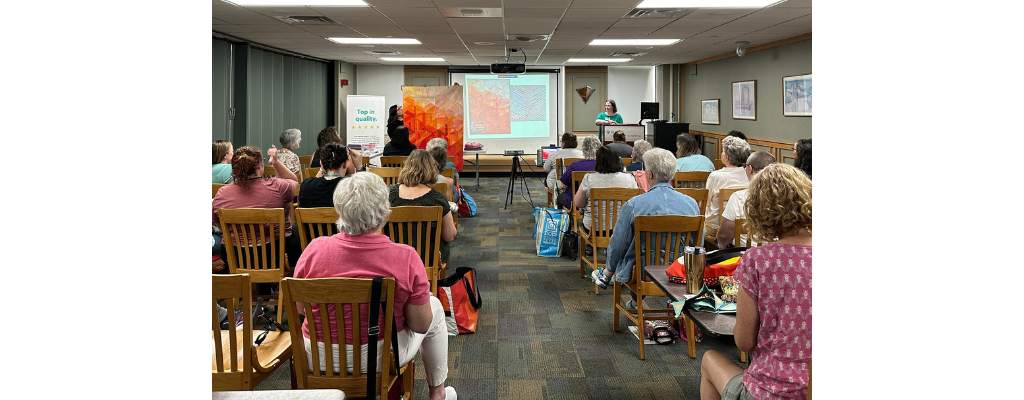 Cassandra Beaver speaks to a packed house